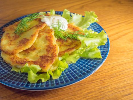 potato pankakes with cream frache and dill - draniki