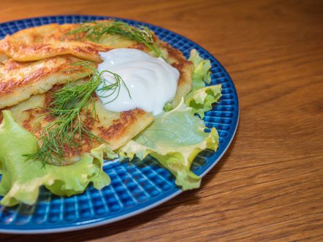 potato pankakes with cream frache and dill - draniki