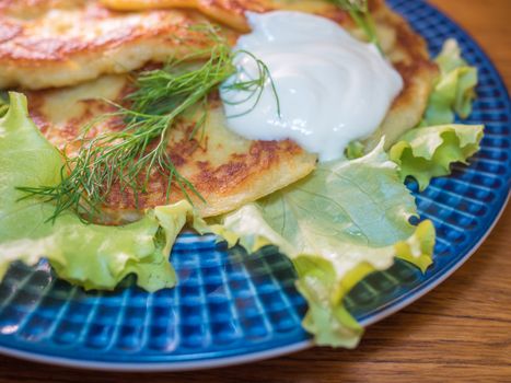 potato pankakes with cream frache and dill - draniki