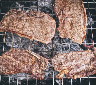 Photograph of some grilled meat juicy steaks