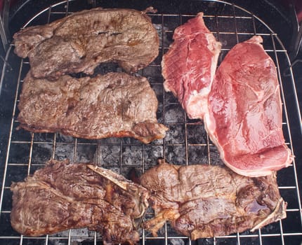 Photograph of some grilled meat juicy steaks