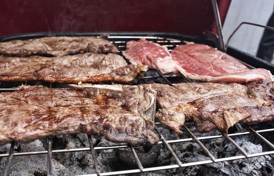 Photograph of some grilled meat juicy steaks