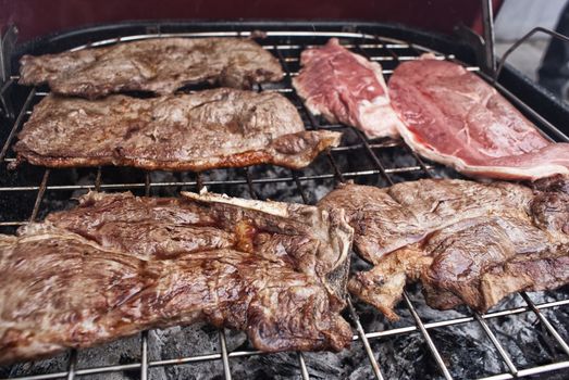 Photograph of some grilled meat juicy steaks