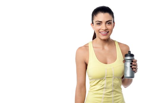 Sporty young woman posing after workout