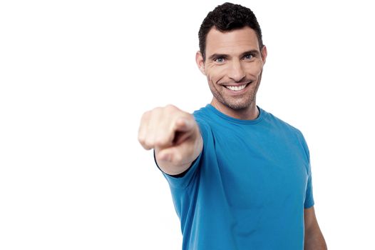 Casual man pointing towards to camera