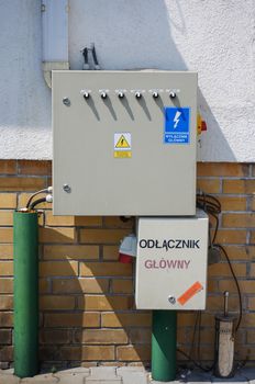 POZNAN, POLAND - JULY 18, 2015: Electricity boxes with buttons on a wall