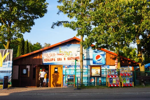 SIANOZETY, POLAND - JULY 18, 2015: People entering a wooden party house 