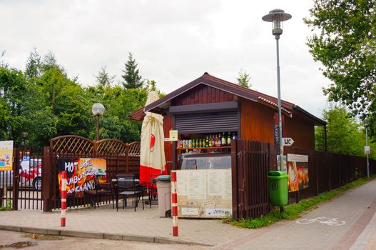 SIANOZETY, POLAND - JULY 26, 2015: Wooden fast food bar by sidewalk