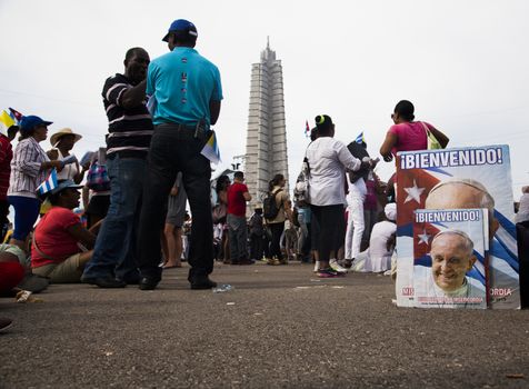 CUBA, Havana: People attend Pope Francis' mass in Revolution Square in Havana, on September 20, 2015. Pope Francis is on the first full day of his three day visit to Cuba, where he meets President Raul Castro and Fidel Castro and hold Mass in Revolution Square before travelling to Holguin, Santiago de Cuba and El Cobre, then onwards to the United States.