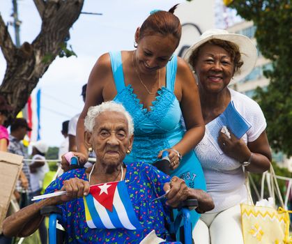 CUBA, Havana: Cuban women are pictured as Pope Francis celebrates mass in Revolution Square, in Havana, on September 20, 2015. Pope Francis is on the first full day of his three day visit to Cuba, where he meets President Raul Castro and Fidel Castro and hold Mass in Revolution Square before travelling to Holguin, Santiago de Cuba and El Cobre, then onwards to the United States.