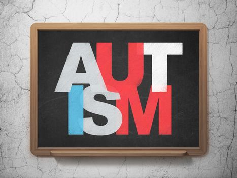 Medicine concept: Painted multicolor text Autism on School Board background
