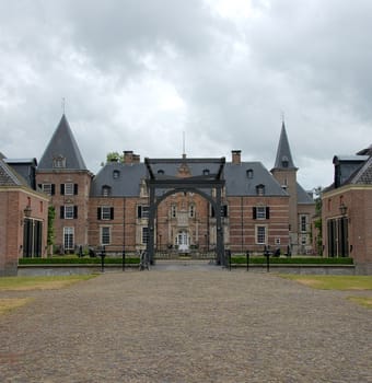 Late medieval castle 'Twickel' with drawbridge and old street near Delden in the Netherlands