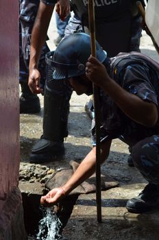 NEPAL, Terai: Nepal announced its first democratic constitution, sparking outrage among the Madeshi and Tharu ethnic communities on September 20, 2015. 	Demonstrators have staged protests in different parts of the Terai region, demanding a new demarcation of the state so that they are more fairly represented under the new constitution. 	The riots became violent and security personnel opened fire on protesters, killing at least one and leaving more than a dozen injured on September 20. 