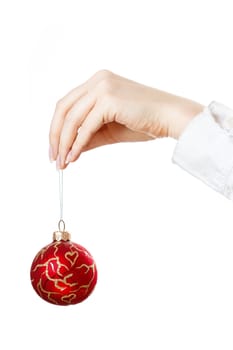 Decorating christmas tree with balls, ribbons and stuff, isolated on white background