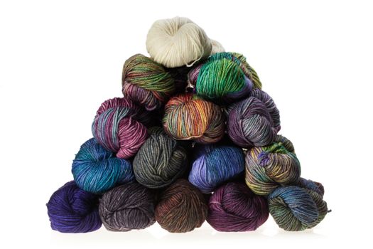 Set of colorful wool yarn balls. Hanks are set out in a pile.