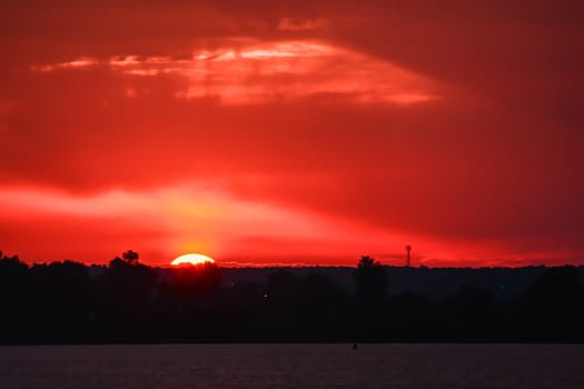 Red sunset over a northern lake