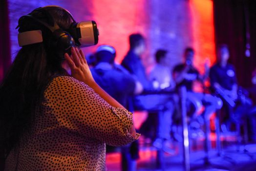 CANADA, Toronto: An attendee wears a virtual reality headset during a panel discussion at the Festival of International Virtual and Augmented Reality Stories on September 19,2015.  	The festival was an exhibition of virtual reality and augmented films that are experienced through a virtual reality headset.