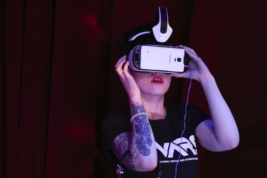 CANADA, Toronto: An assistant configures a virtual reality headset at the Festival of International Virtual and Augmented Reality Stories on September 19,2015.  	The festival was an exhibition of virtual reality and augmented films that are experienced through a virtual reality headset.