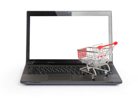 Small shopping cart on laptop on isolated white background, front view
