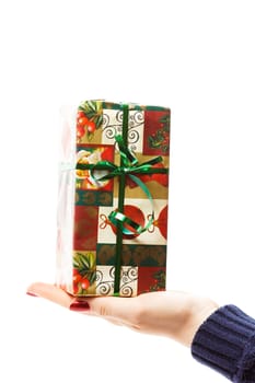 hand with christmas gift isolated on white background