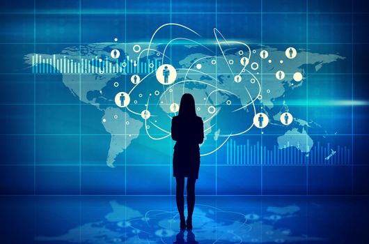 Businesswomans silhouette on abstract blue background with virtual world map