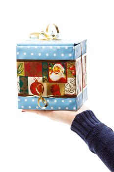 hand with christmas gift isolated on white background