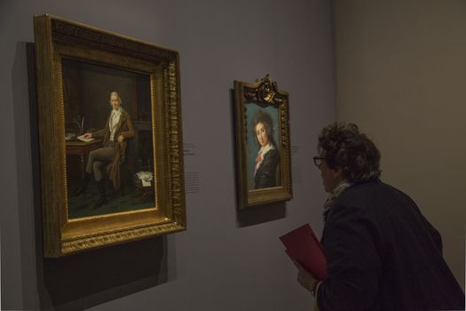 FRANCE, Paris: A man watches two paintings of �lisabeth Louise Vig�e Le Brun in Le Grand Palais, in Paris on September 21, 2015. �lisabeth Louise Vig�e Le Brun (1755-1842) is one of the greater portrait painter of her time. She was chosen to paint the very famous queen of France Marie-Antoinette. 