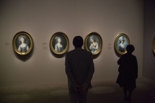 FRANCE, Paris: Some visitors watch a portrait of �lisabeth Louise Vig�e Le Brun in Le Grand Palais, in Paris on September 21, 2015. �lisabeth Louise Vig�e Le Brun (1755-1842) is one of the greater portrait painter of her time. She was chosen to paint the very famous queen of France Marie-Antoinette. 