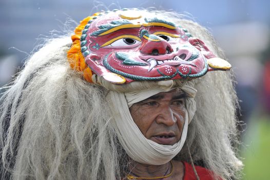 NEPAL, Kathmandu: A man wearing a traditional mask attends celebrations in Kathmandu, Nepal on September 21, 2015, one day after the government unveiled the country's first democratic constitution in a historic step. Out of the 598 members of the Constituent Assembly, 507 voted for the new constitution, 25 voted against, and 66 abstained in a vote on September 16, 2015. The event was marked with fireworks and festivities, but also with protests organized by parties of the Tharu and Madhesi ethnic communities.Photos taken by Newzulu contributor Narayan Maharjan show the Nepalese people donning traditional garb and celebrating with folk music and dancing.