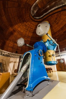 Old trophy large optical telescope at display