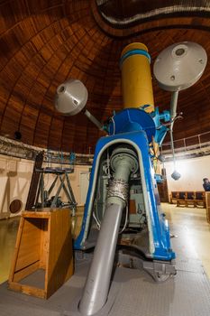 Old trophy large optical telescope at display