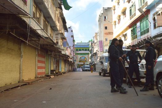 INDIA, Ajmer: Police stand guard after a hoax bomb scare evacuated thousands of pilgrims from the Sufi shrine of Ajmer Sharif Dargah in Rajasthan on September 21, 2015.The call prompted security officials and bomb disposal crew to conduct a thorough search of the shrine, which lasted for more than an hour. After finding no suspected packages at the shrine, the call was determined to be a hoax. 