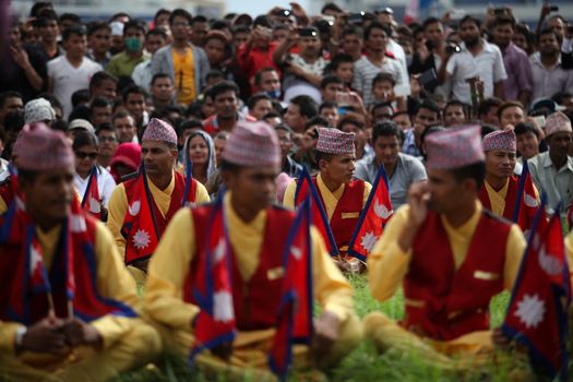 NEPAL, Kathmandu: Men wearing traditional clothing attends celebrations in Kathmandu, Nepal on September 21, 2015, one day after the government unveiled the country's first democratic constitution in a historic step. Out of the 598 members of the Constituent Assembly, 507 voted for the new constitution, 25 voted against, and 66 abstained in a vote on September 16, 2015. The event was marked with fireworks and festivities, but also with protests organized by parties of the Tharu and Madhesi ethnic communities.Photos taken by Newzulu contributor Dinesh Shrestha show the Nepalese people donning traditional garb and celebrating with folk music and dancing.