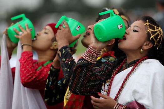 NEPAL, Kathmandu: Women wearing traditional clothing attends celebrations in Kathmandu, Nepal on September 21, 2015, one day after the government unveiled the country's first democratic constitution in a historic step. Out of the 598 members of the Constituent Assembly, 507 voted for the new constitution, 25 voted against, and 66 abstained in a vote on September 16, 2015. The event was marked with fireworks and festivities, but also with protests organized by parties of the Tharu and Madhesi ethnic communities.Photos taken by Newzulu contributor Dinesh Shrestha show the Nepalese people donning traditional garb and celebrating with folk music and dancing.