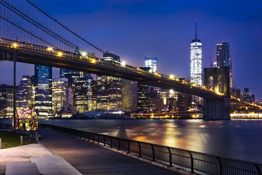 New York City - beautiful sunrise over manhattan with manhattan and brooklyn bridge USA