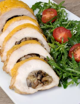 Chicken fillet stuffed with mushrooms on the cheese crust