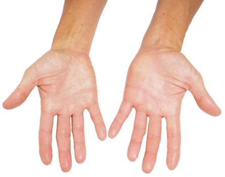 Hands of a male person with fingers spread isolated towards white