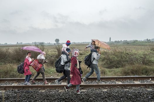 HUNGARY, Roszke: A family walks along train tracks as the difficulties of living in Hungary's Roszke refugee camp is documented between September 8 and 12, 2015, as Europe's refugee crisis continues. 