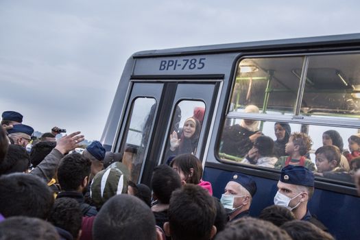 HUNGARY, Roszke: Refugees are placed on a bus as the difficulties of living in Hungary's Roszke refugee camp is documented between September 8 and 12, 2015, as Europe's refugee crisis continues. 