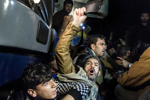 HUNGARY, Roszke: Refugees protest by sitting in front of buses preventing them from taking them to the registration camps as the difficulties of living in Hungary's Roszke refugee camp is documented between September 8 and 12, 2015, as Europe's refugee crisis continues. 