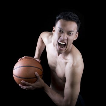 Asian young basketball player on black background