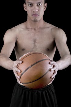 Asian young basketball player on black background