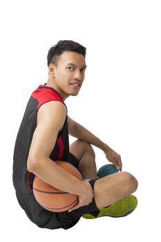 Asian young basketball player on white background