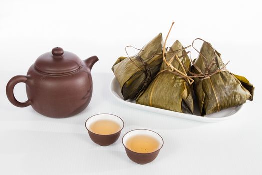 Chinesedumplings, Zongzi in white background with Chinese tea, celebrate for Dragon Boat Festival.