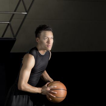 Asian young basketball player on basketball court