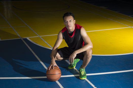 Asian young basketball player on basketball court