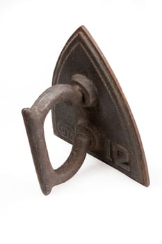 Old metal iron on isolated studio white background