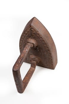 Old metal iron on isolated studio white background