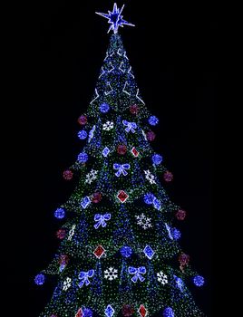 glowing colorful electronic Christmas Tree over black (diode type)