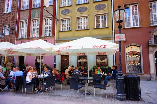GDANSK, POLAND - JULY 29, 2015: People sitting at a bar in the city center